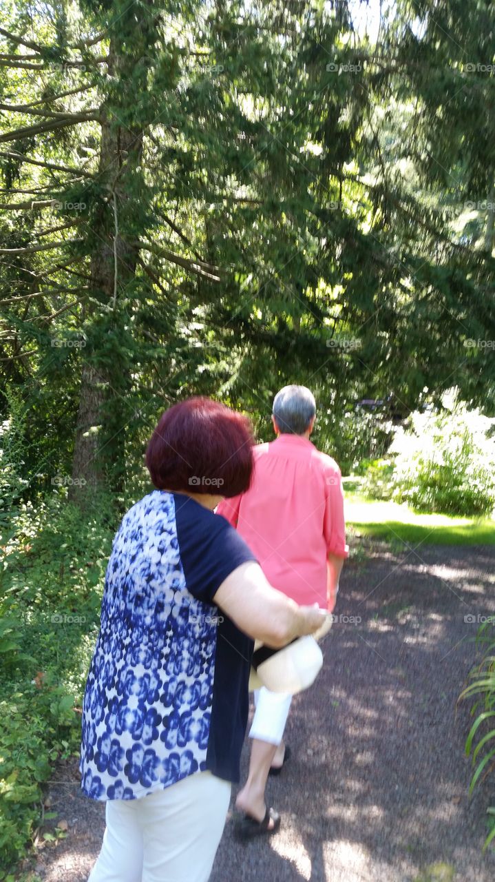 women walking on garden path