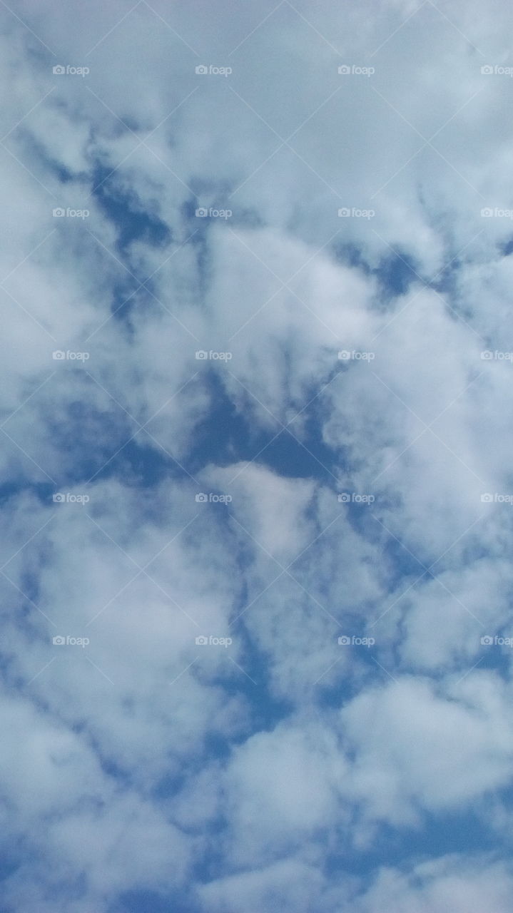 Scenic blue sky with puffy gorgeous 
clouds in beautiful tropical winter day