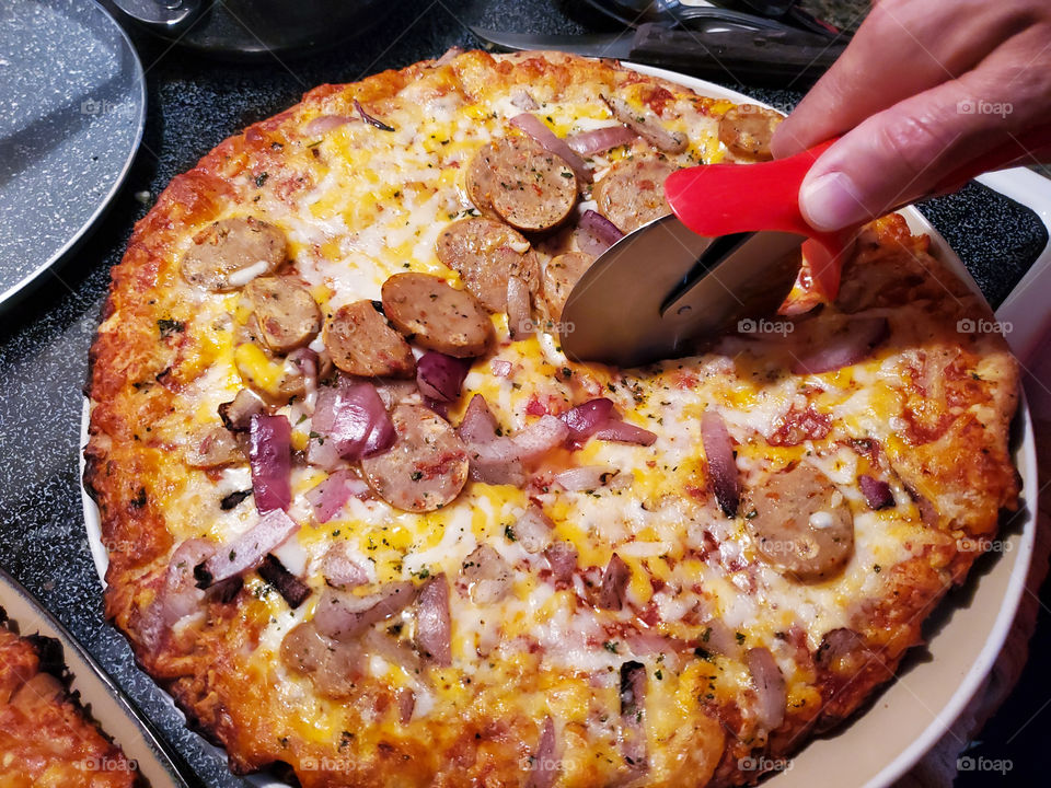 Sweet potatoes sausage BBQ frozen pizza just out of the oven.