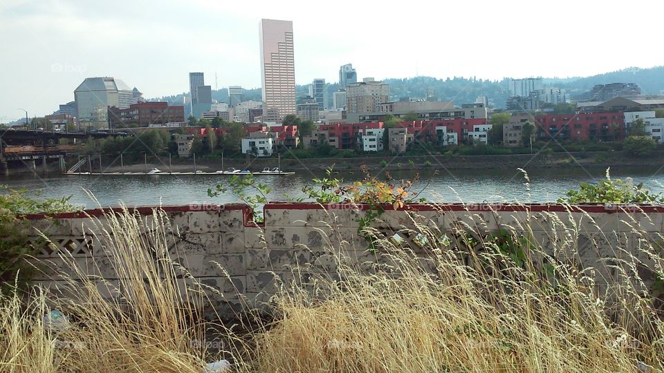 Portland West. Portland's downtown skyline featuring Big Pink as pictured from the East Bank of the Willamette River.