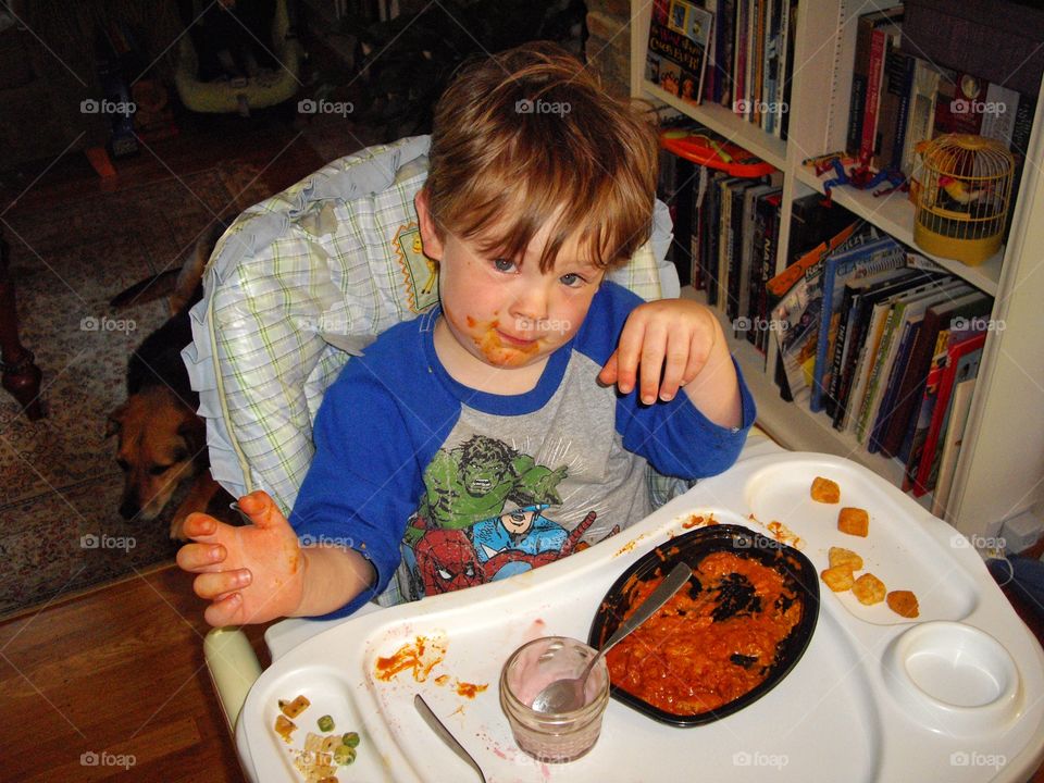 Messy Child Learning To Eat
