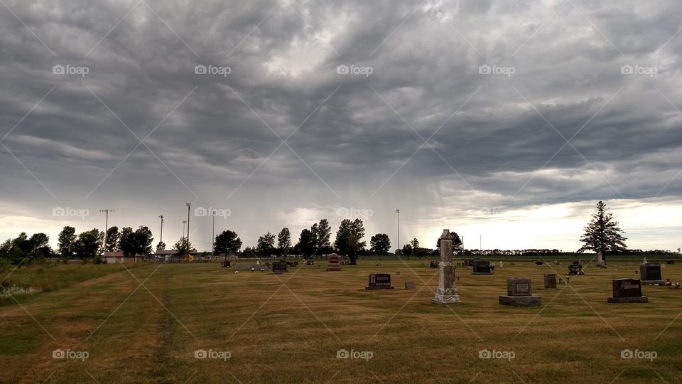 graveyard with some cool storm clouds in Minnesota. We get some weird weather up here!