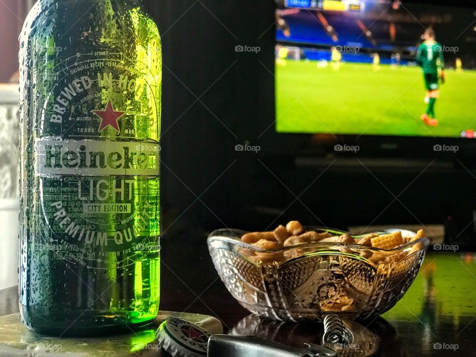 Heineken beer, sports and a snack
