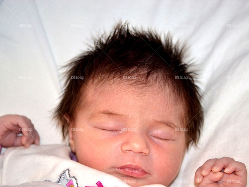 High angle view of baby sleeping