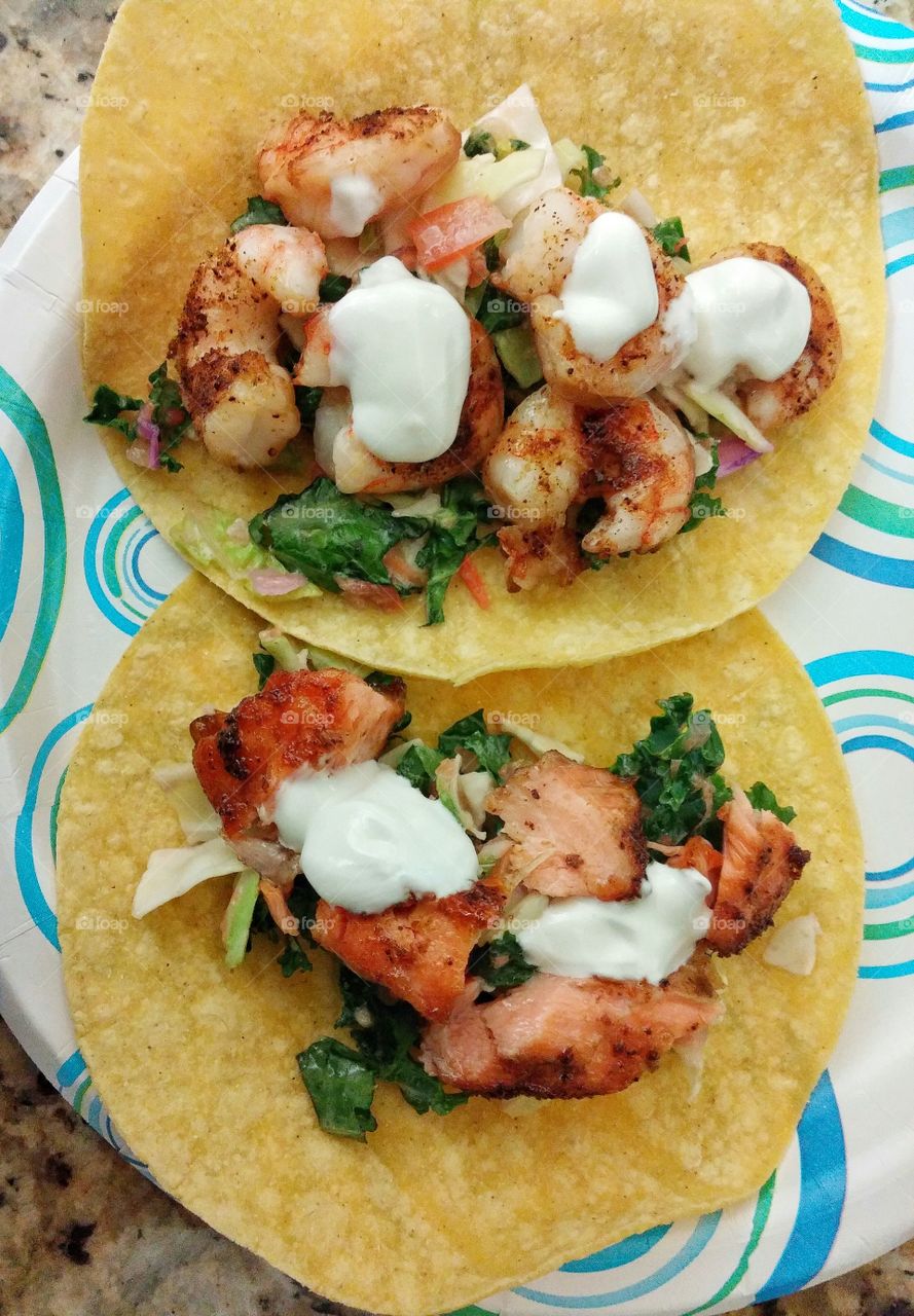 seafood tacos. fresh tacos made with salmon and shrimp
