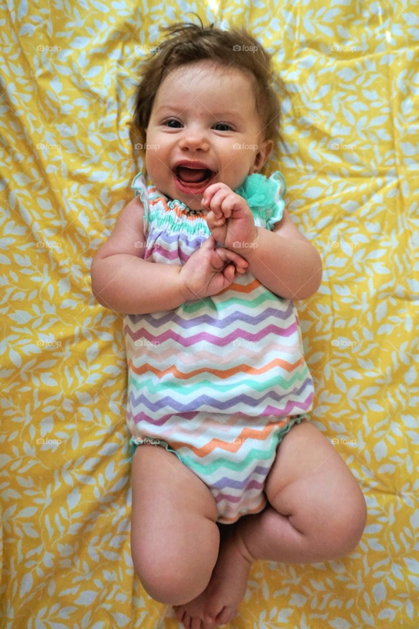 Happy Baby. Squeals all around for this colorful four month old.