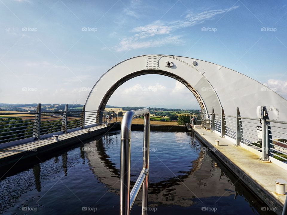 The Falkirk Wheel ...The  most unusual bridge I have ever been on ... Like a giant Ferris wheel carrying boats !Photo taken from the front of the barge floating high above the ground as we move to reach the canal down below ....