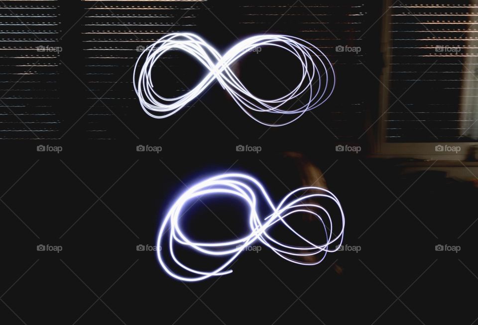 Two symbols of eternity drawn with light