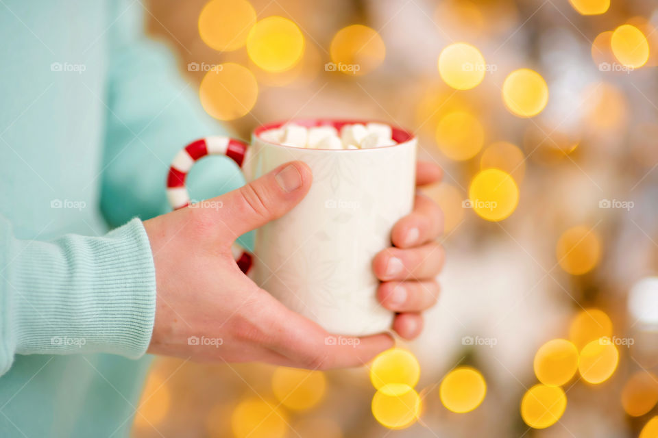 cup of coffee in a cozy festive Christmas atmosphere