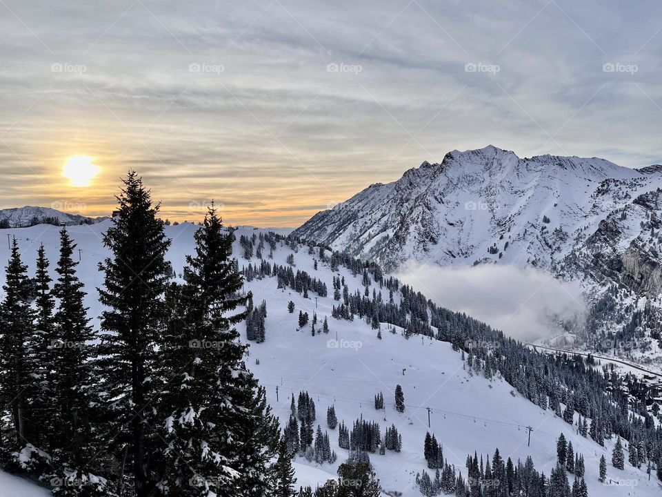 A beautiful winter sunset at Snowbird ski resort in the mountains of Utah, USA