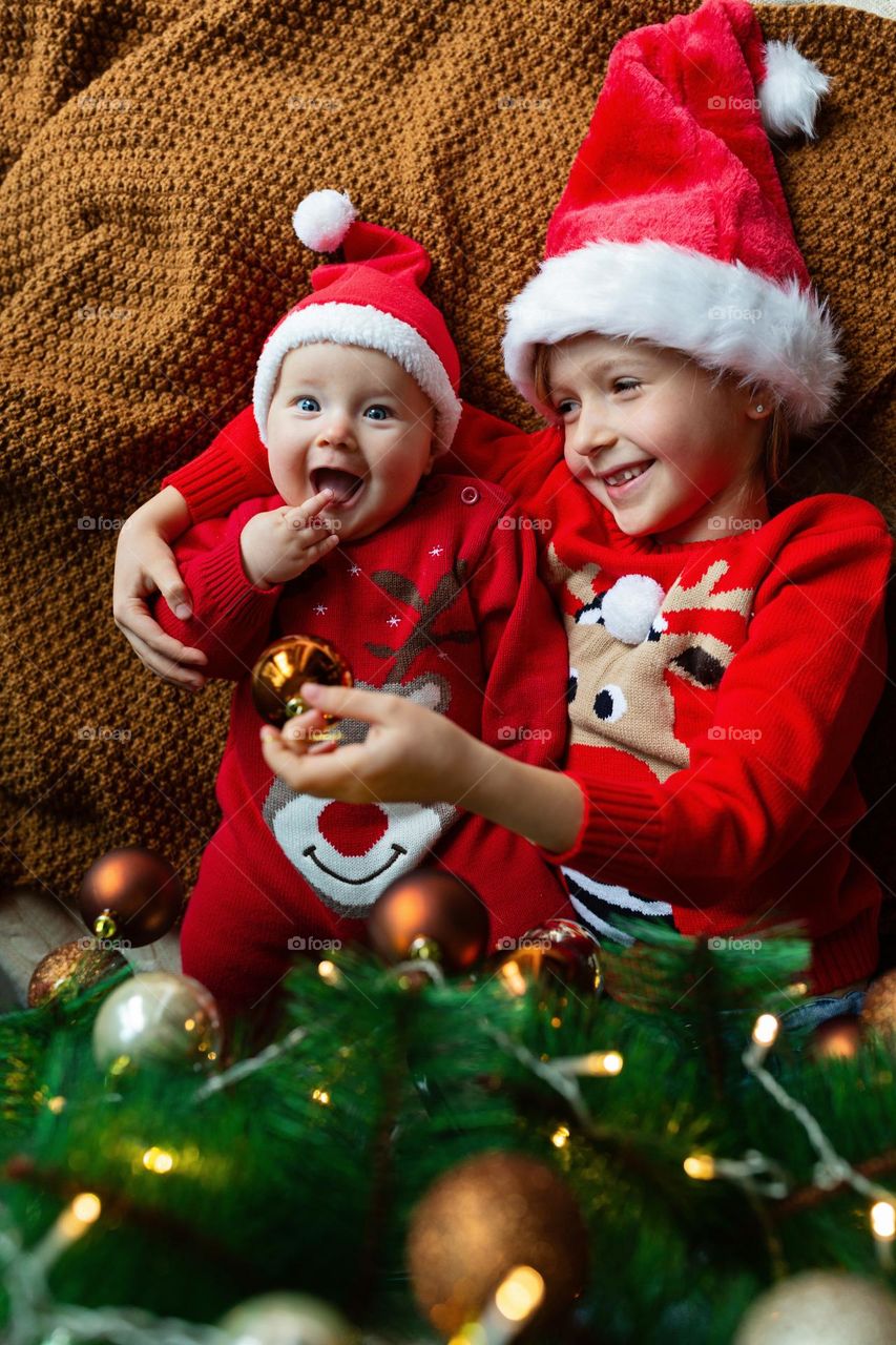 Cute siblings celebrating winter holidays 