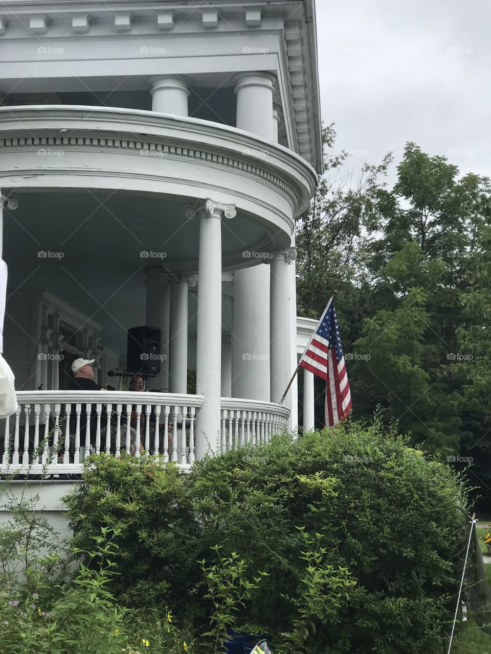 The Columns in Milford, Pennsylvania USA with Flag on front porch  