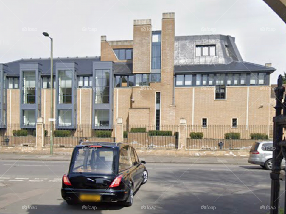 The scene of the car parked in front of the door