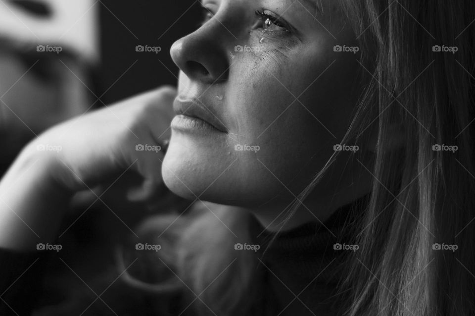 woman crying and feeling sad