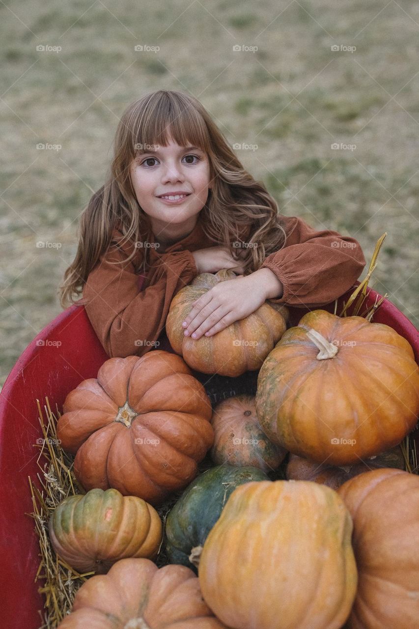 Autumn mood, beautiful girl with pumpkin 