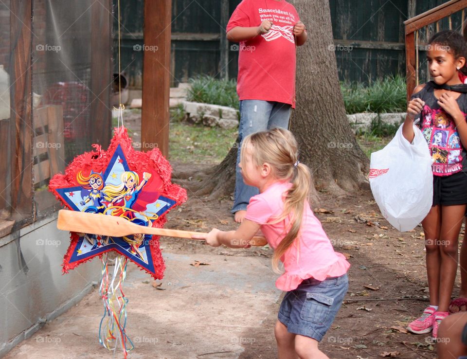 Fierce Little Girl Whacking Pinata