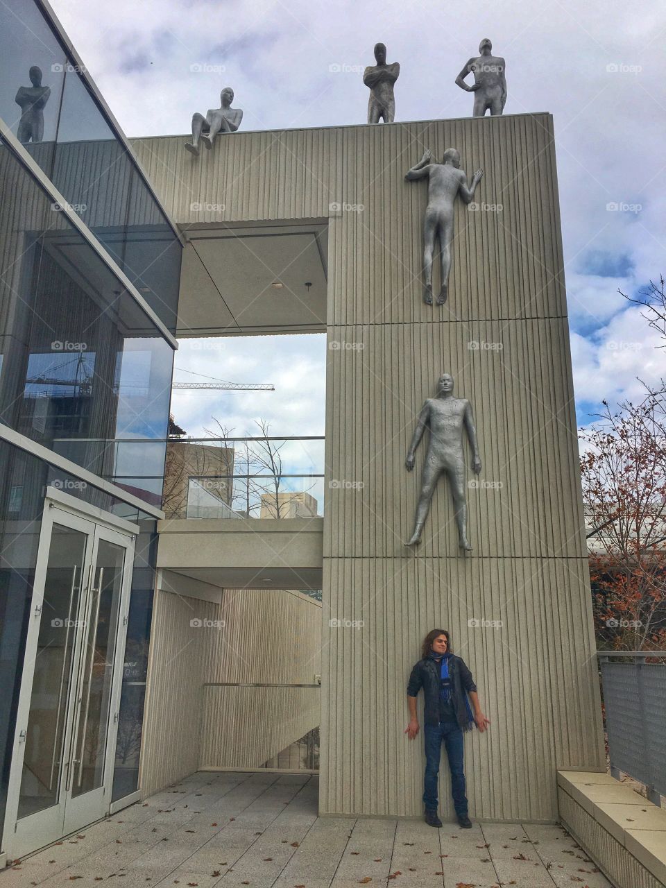 Man at art sculpture in Dallas 