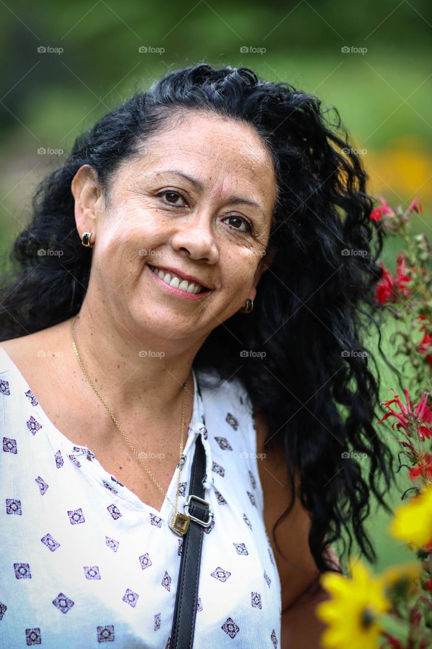 Middle-aged latin-american woman with dark curly hair