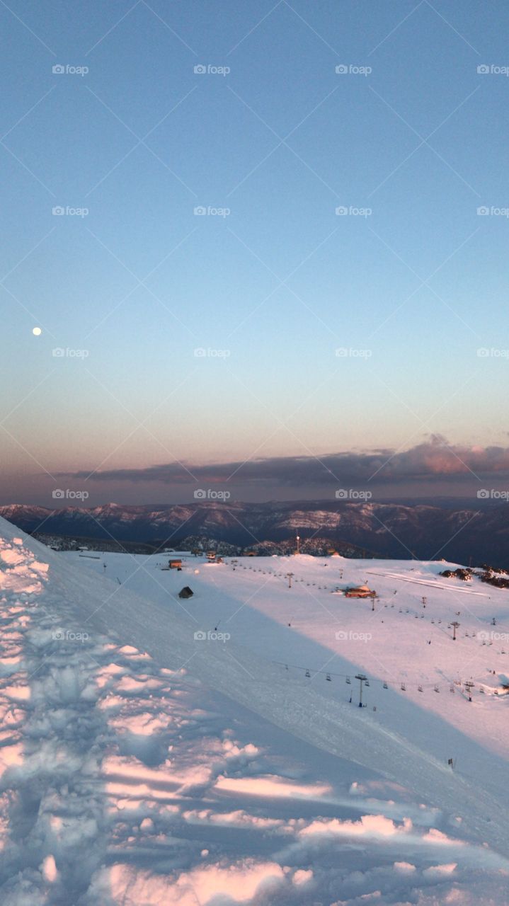 The moon rises over the ski fields