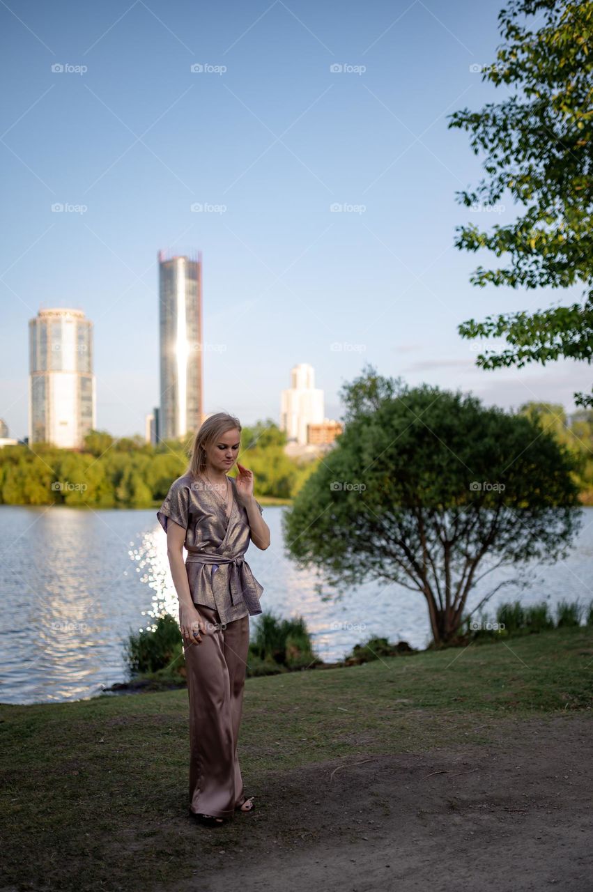 Woman walking on urban park 