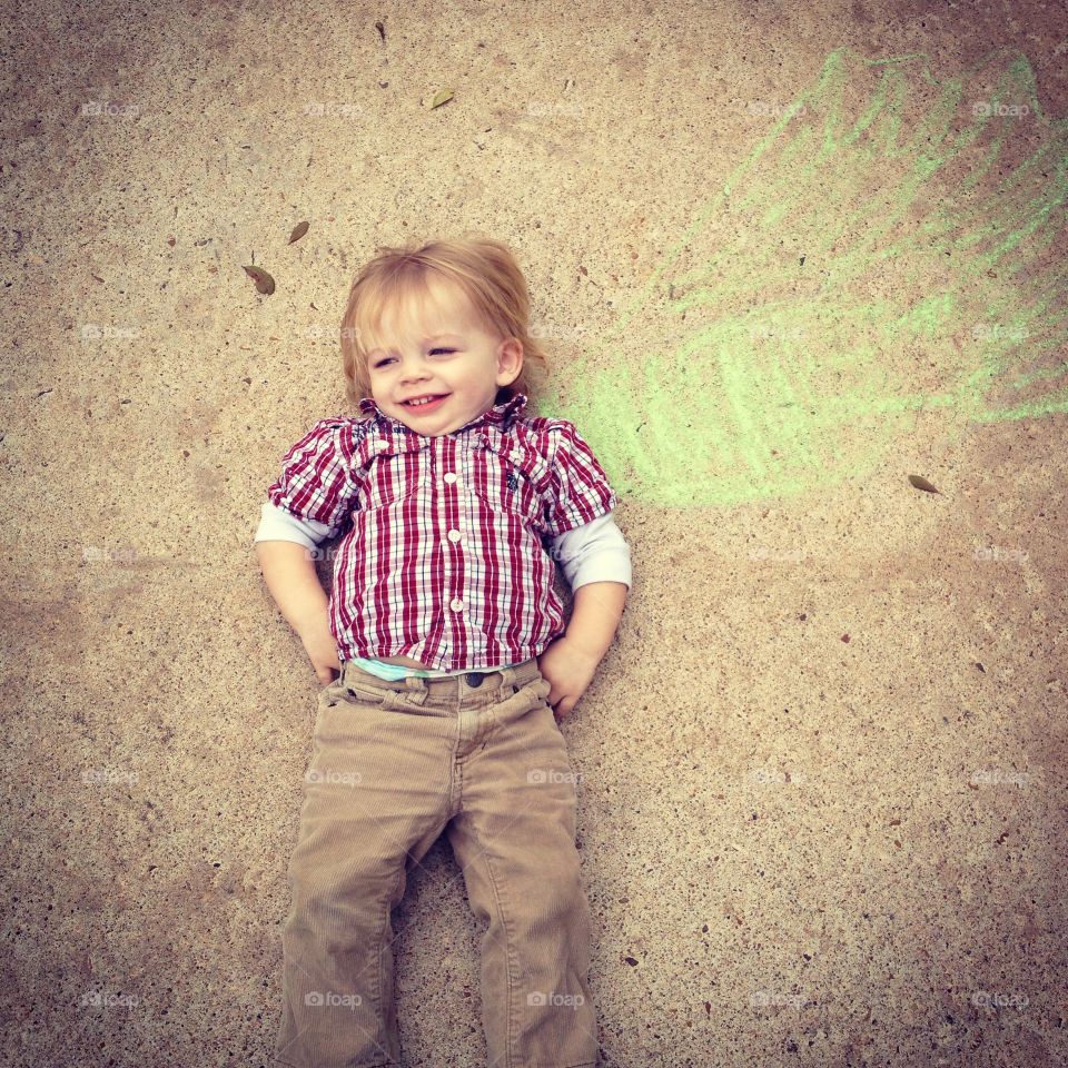 SuperBaby. A rare cool day in south Texas means playing with sidewalk chalk. 