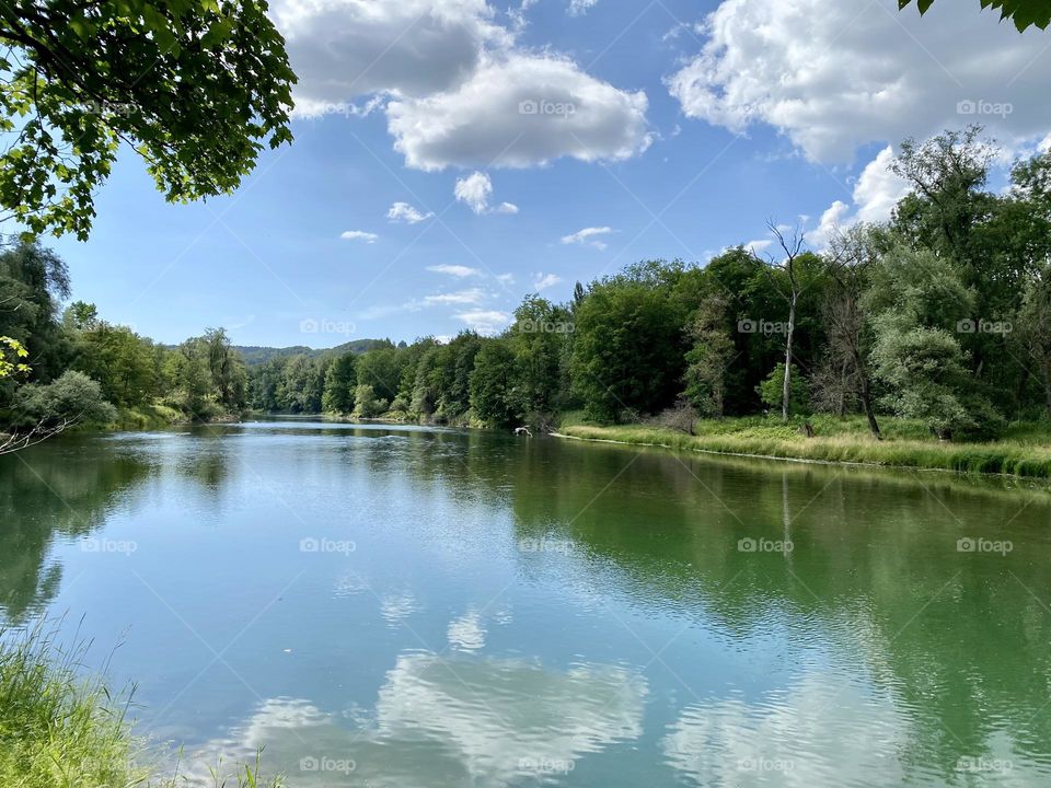 water landscape grass and clouds