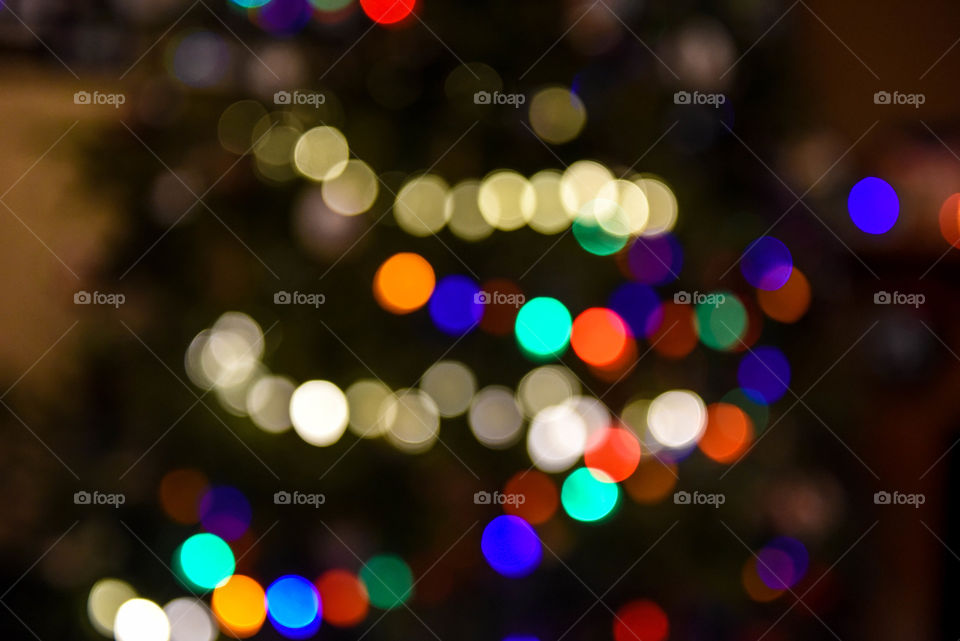 Blurred multicolored illuminated holiday lights