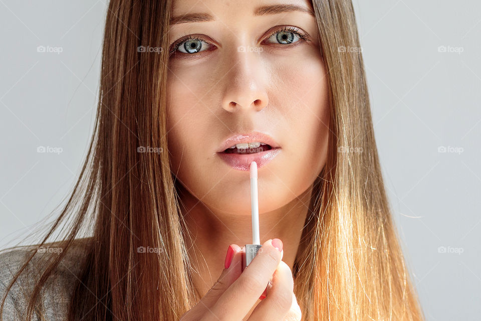 Woman putting makeup 