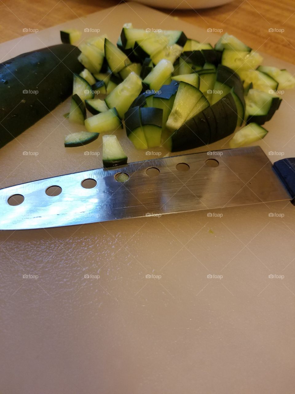 chopping cucumber