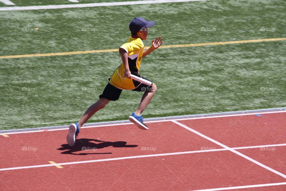 Boy running relay