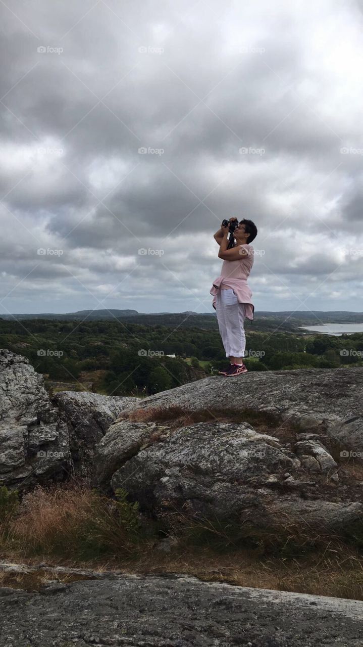 Woman taking pictures in the nature