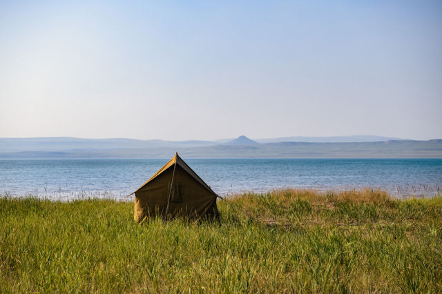 A camp on a lake shore