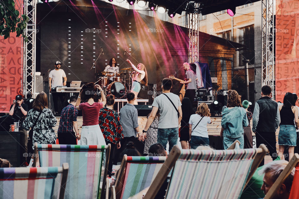 People dancing on a music festival