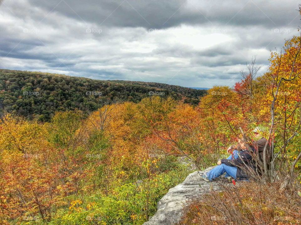 Breathtaking view of autumn mountains from an overlook while hiking.