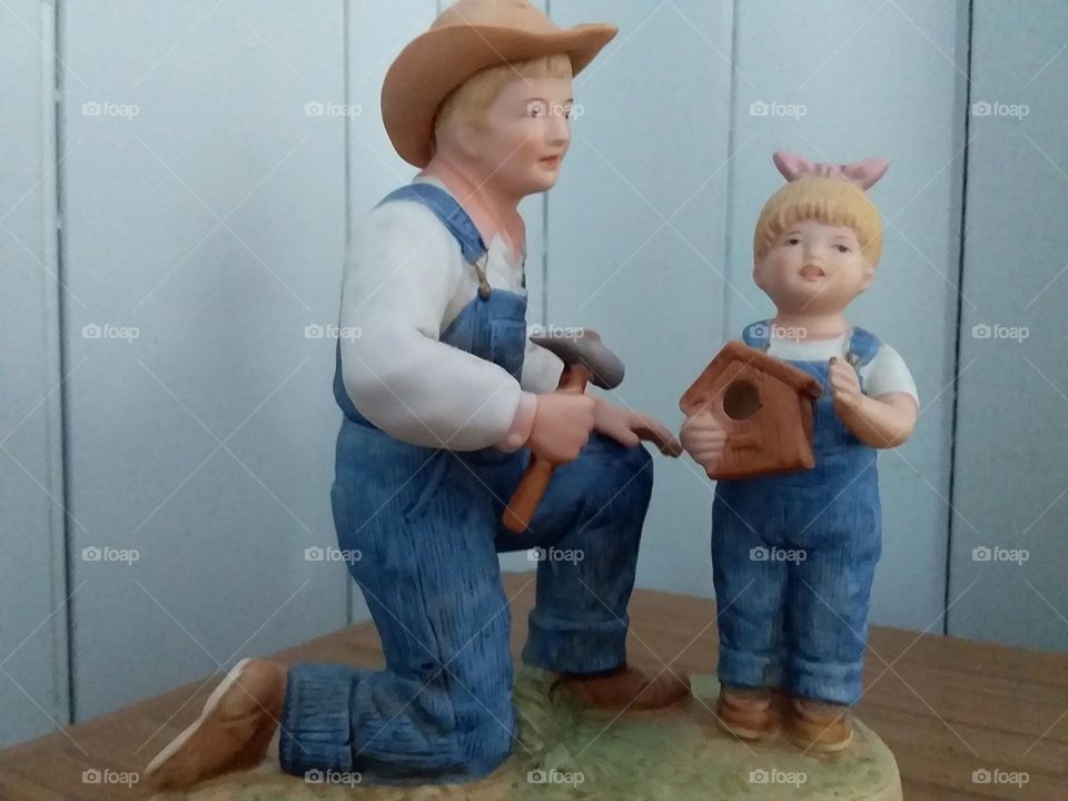 father and son building a birdhouse china ornament