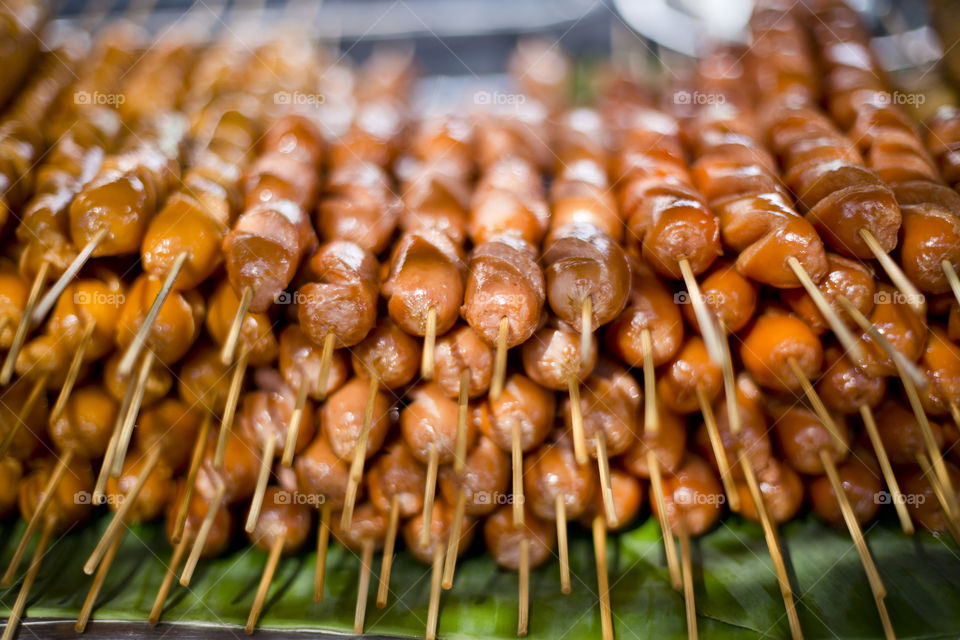 Grilled meats balls skewers. Thai snack at local market