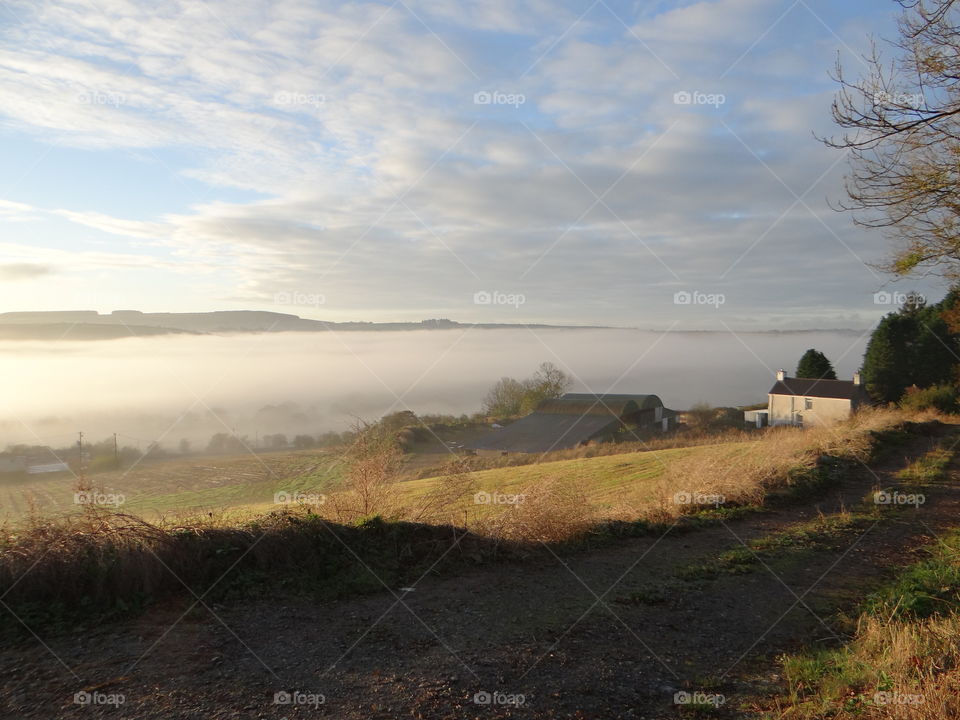 Iridh cottage amongst early morning fog and mist