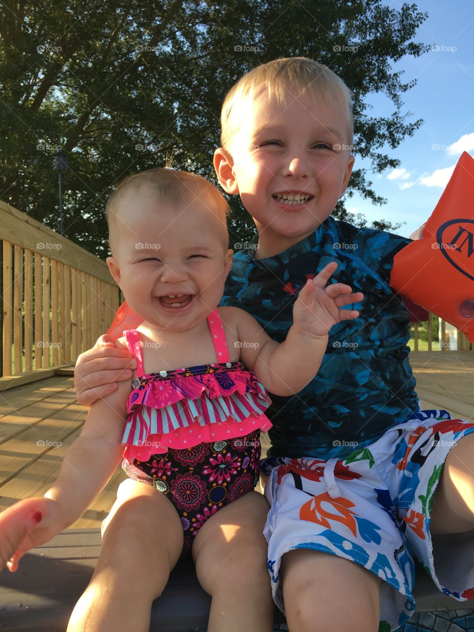 Cute boy with his little sister