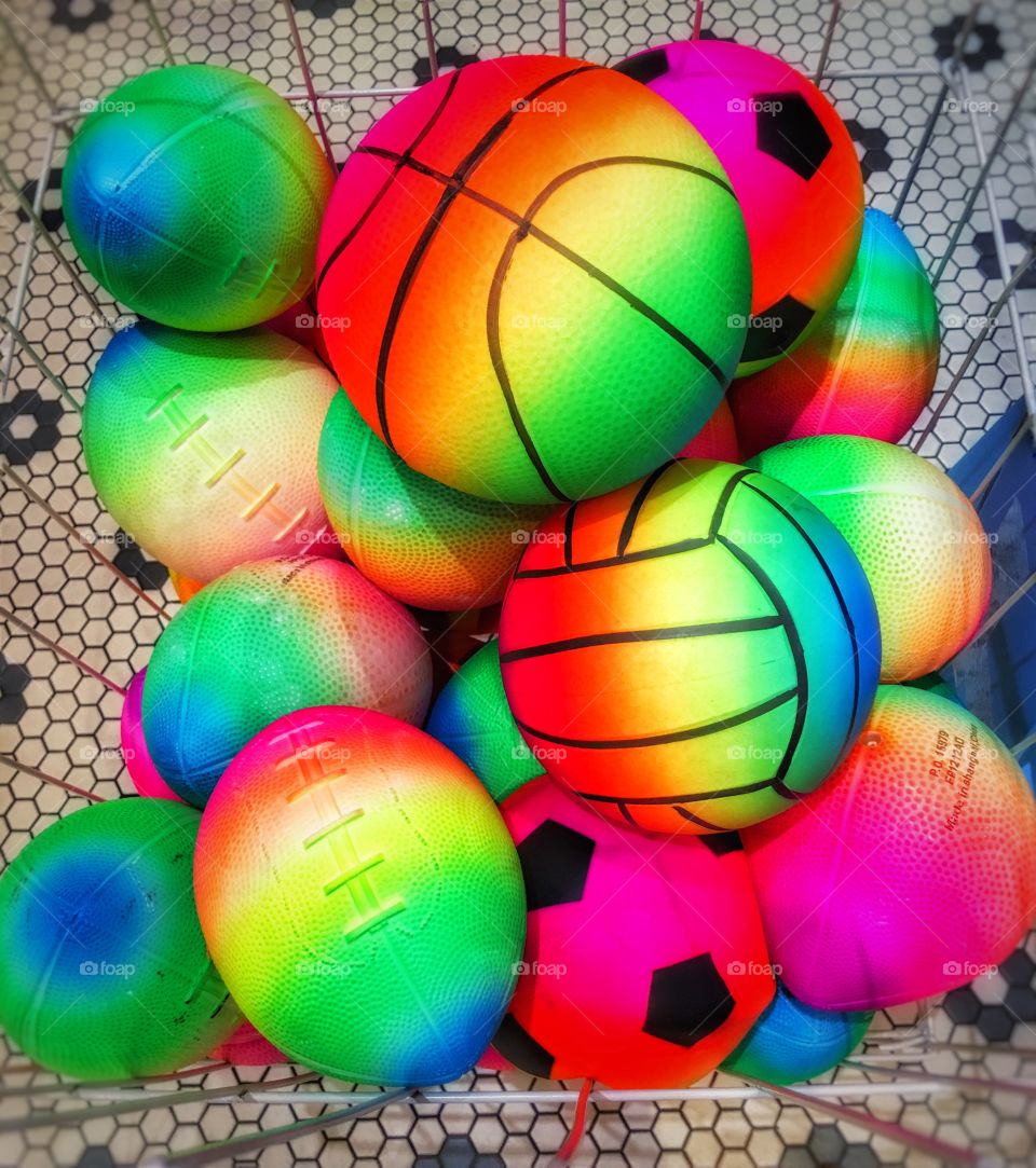 Colorful basketballs, soccer, and footballs 