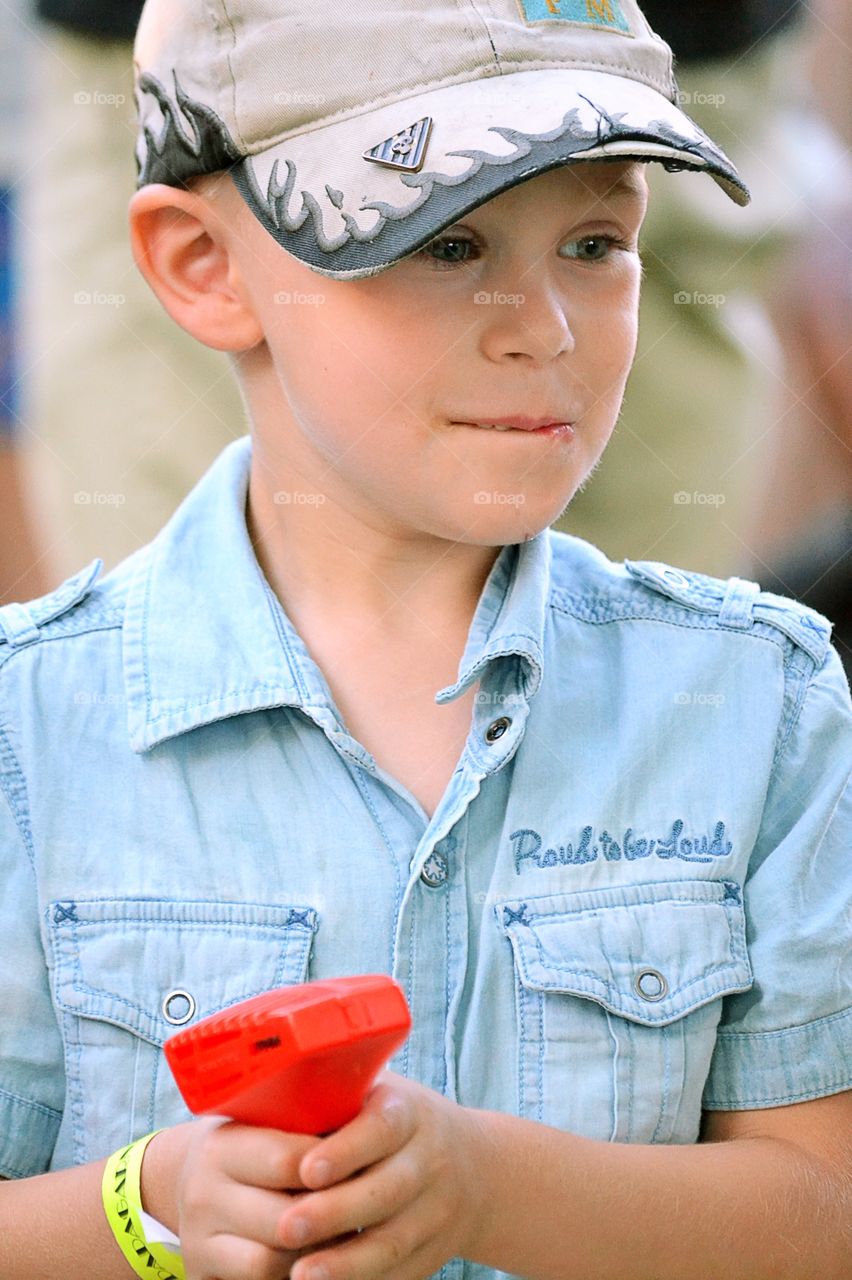 Boy playing. Playing with cars on a track