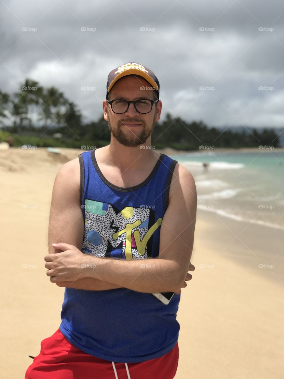 Successful Slovakian nerd in Hawaii, wearing MTV tank top. 