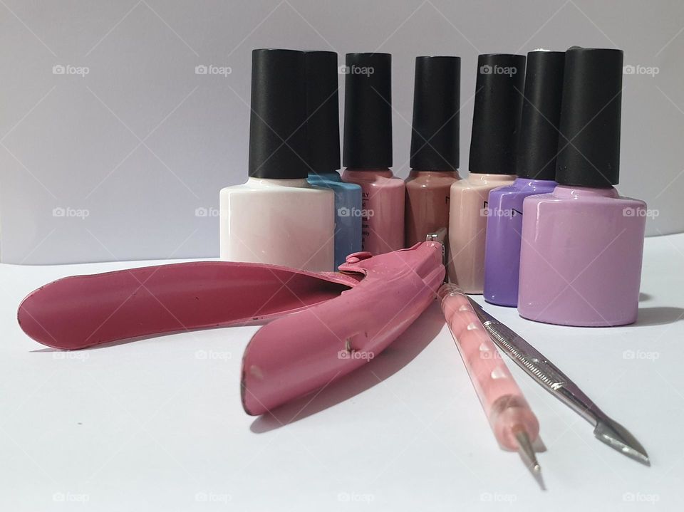 simple design with beauty implements for nails, pastel colors and work implements