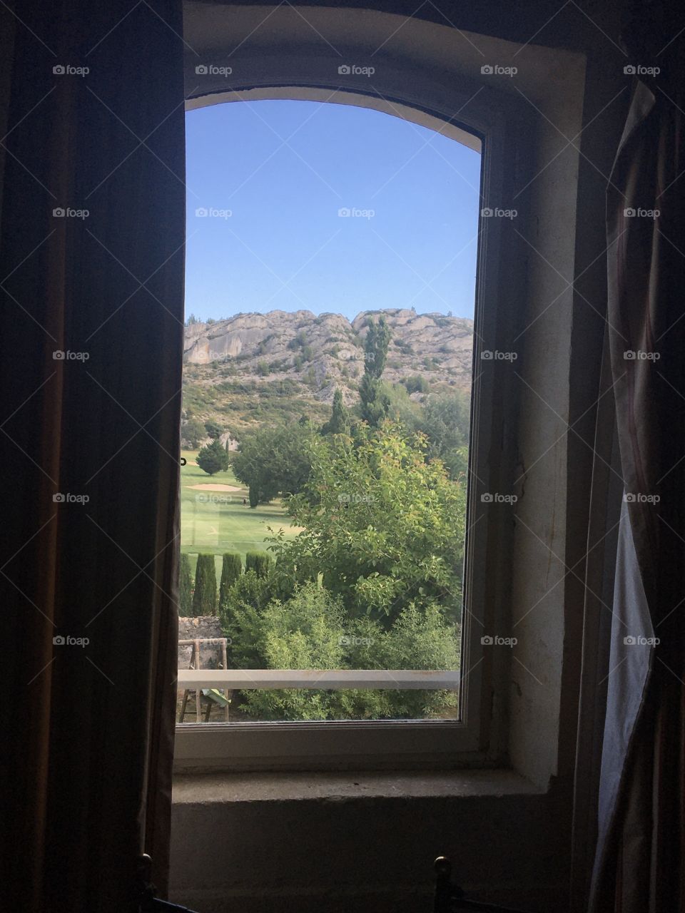 Window opening on landscape from Provence