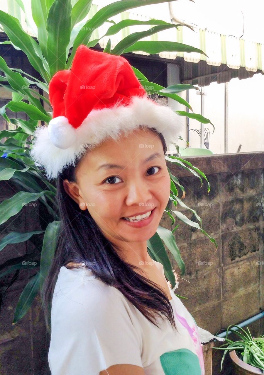 Closeup Asian Thai woman wear Christmas hat