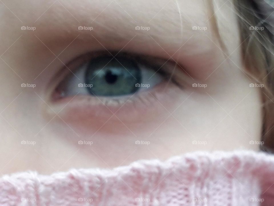 blue eye and pink scarf