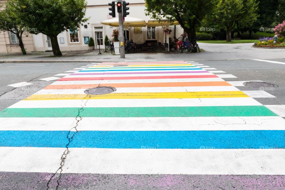 Colorful zebra crossing on an asphalt road in different colors, crosswalk 