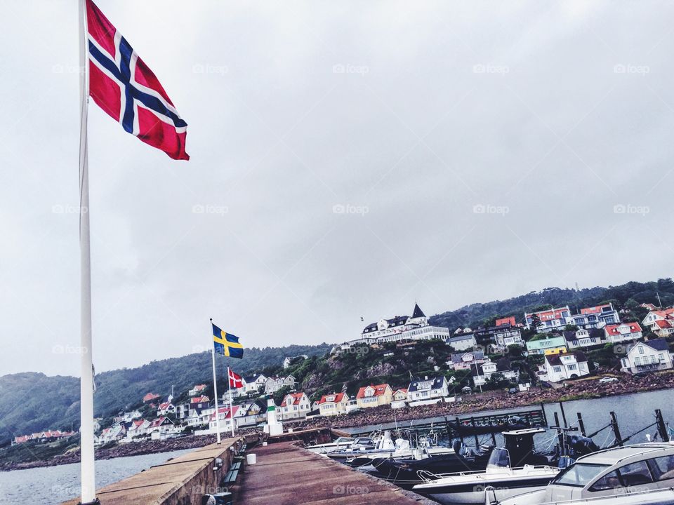On the pier looking up to Grand Hotel in small little town called Mölle in the south west of Sweden .