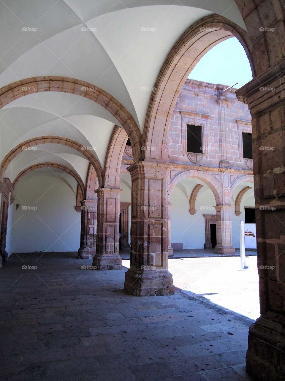 archways around a courtyard in Mexico
