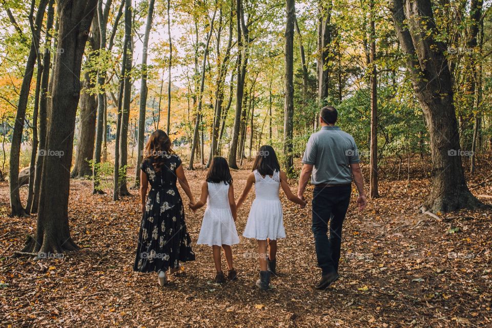 Family of four walking 