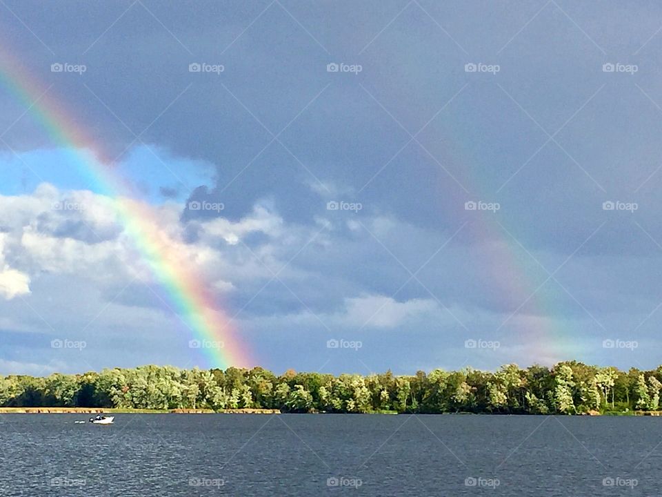 Double rainbow by the lake
